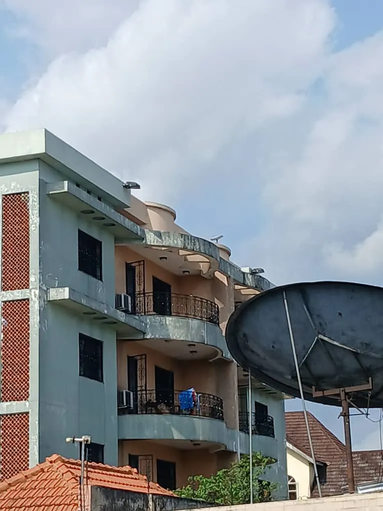 Neighbouring three-storey building next to the rooftop installation