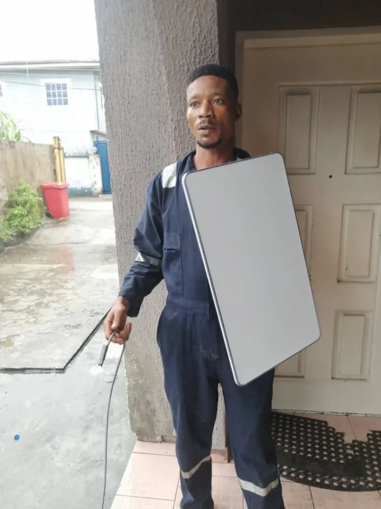 ZuraLink installer with the Starlink dish before mounting