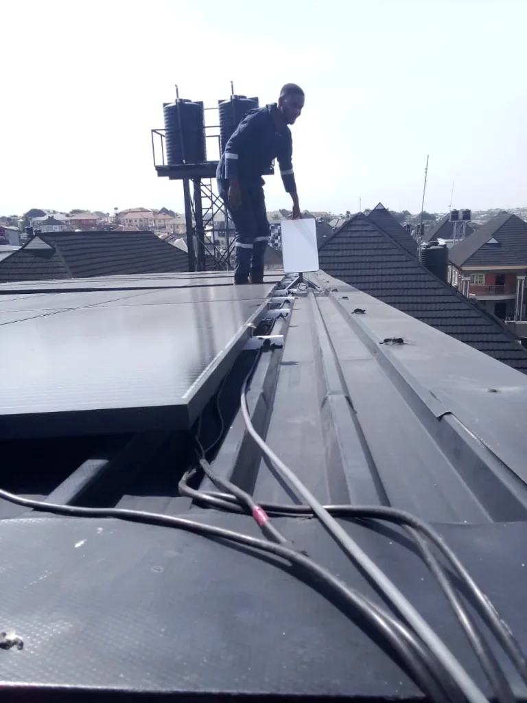 Installer working along the duplex roof ridge