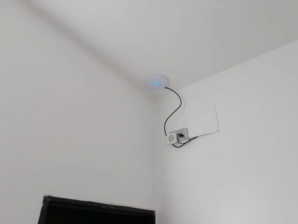 Ceiling access point installed to spread Wi-Fi through the duplex