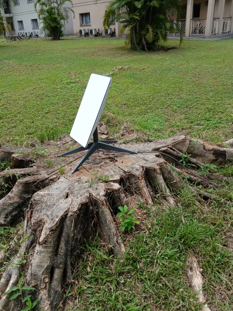 Starlink dish angled to the open sky in the compound