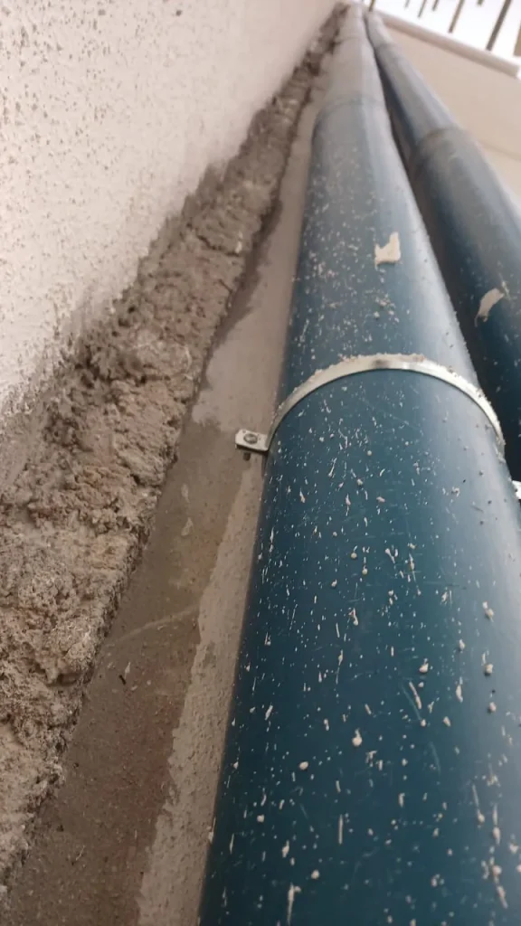Starlink cable protected inside PVC conduit cemented along the roof parapet
