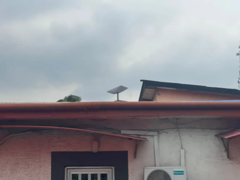 Starlink dish at the roof edge of the office