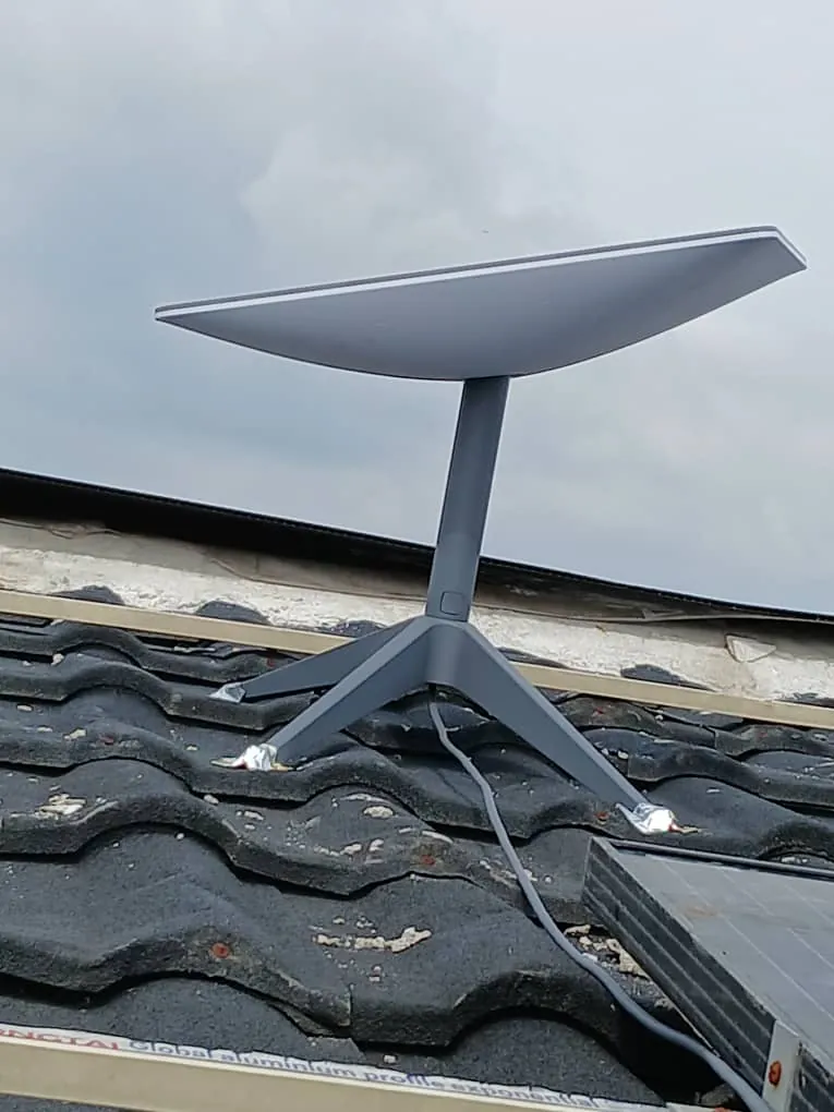 Starlink dish on a tiled roof