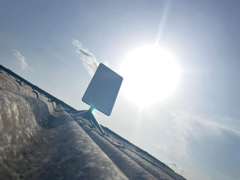 Starlink dish on the roof slope against a clear sky