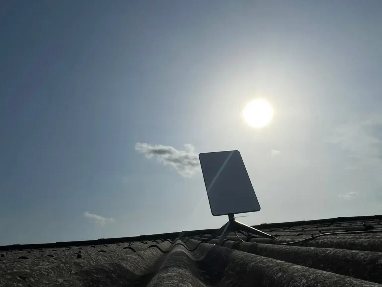 Starlink dish facing the open sky on the roof